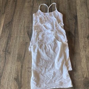 4 white tank tops